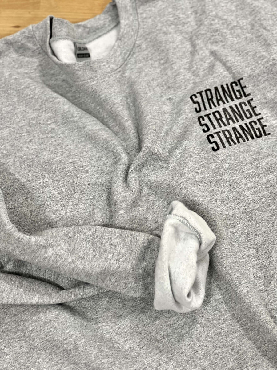 "Strange Strange Strange" small logo crewnecks