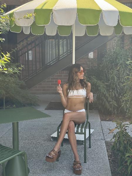 girl with ice cream wearing white bikini